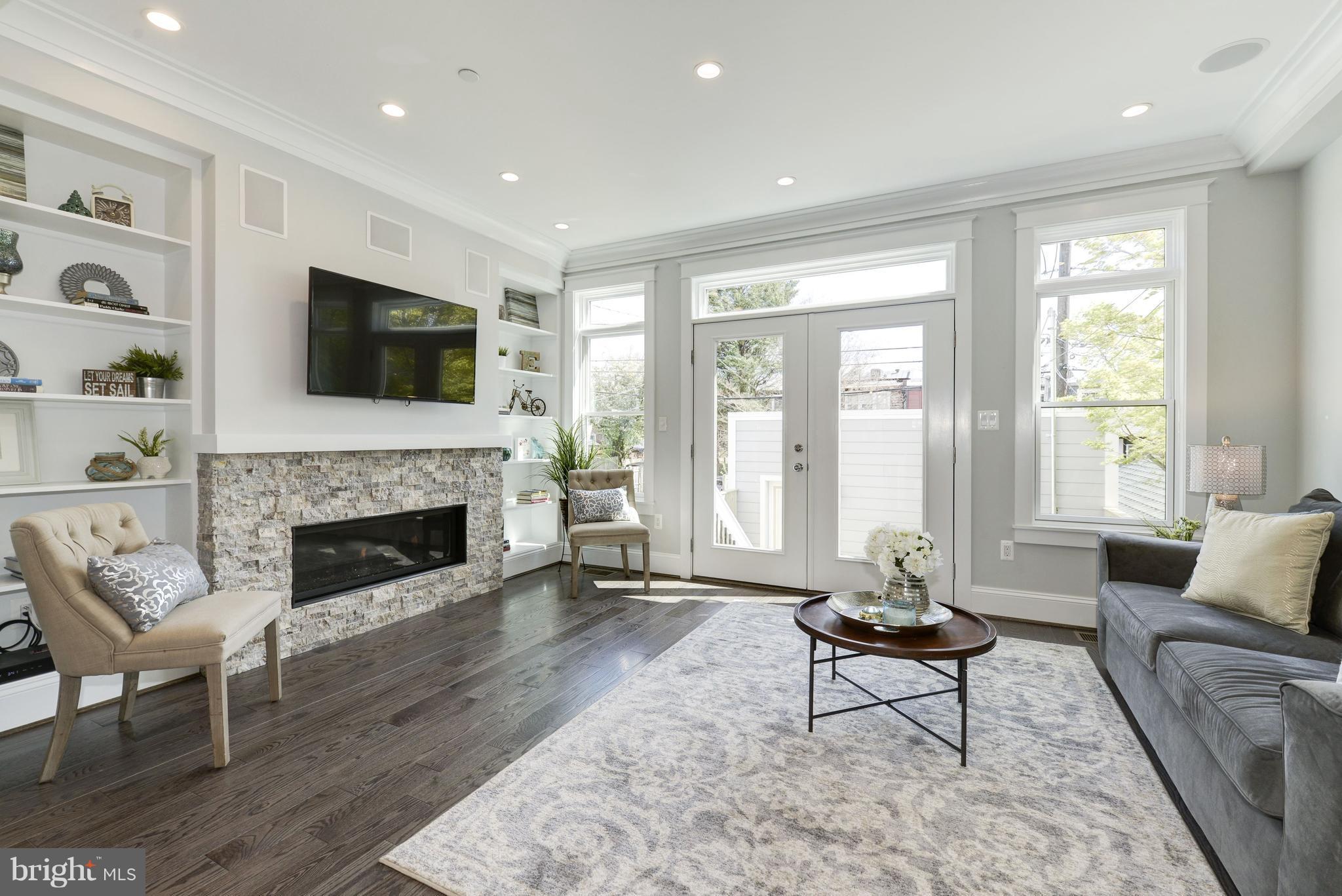 3616 T Street Northwest Washington, DC 20007 - Photo 10 of 29 FAMILY ROOM W/ LINEAR FIREPLACE OPENS TO KITCHEN