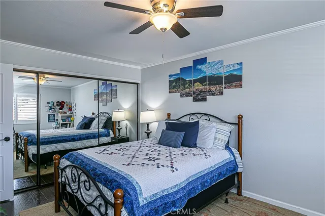 a bedroom with a bed a desk and chair