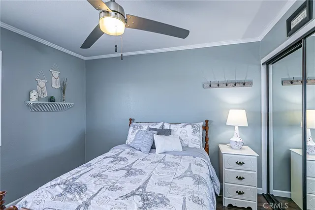 a bedroom with a bed and a lamp