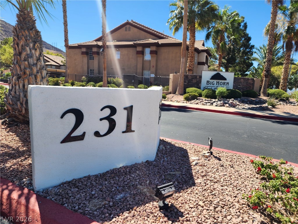 231 West Horizon Ridge Parkway, Unit 1127 Henderson, NV 89012 - Photo 5 of 39 A desert-friendly landscape greets visitors at the entry to a multi-level residential structure.