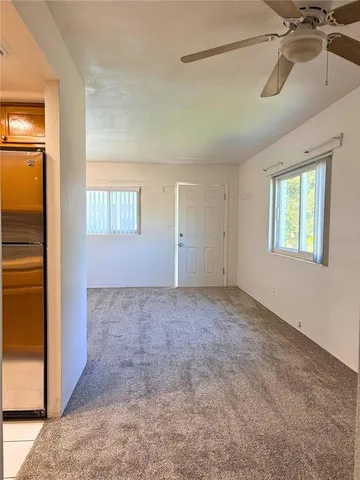 en empty room with windows and closet