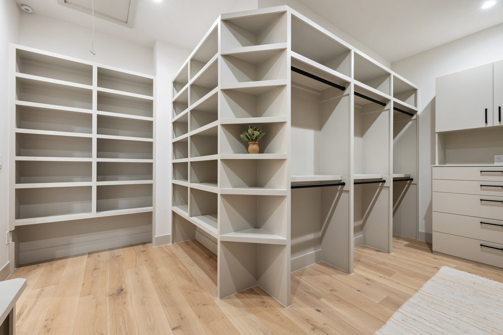 607 Westbrook Drive Austin, TX 78746 - Photo 11 of 32 Custom, walk-in, primary closet.