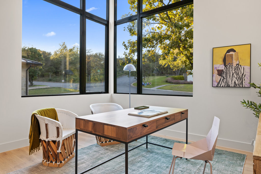 607 Westbrook Drive Austin, TX 78746 - Photo 20 of 32 a view of a dining room with furniture wooden floor and a potted plant