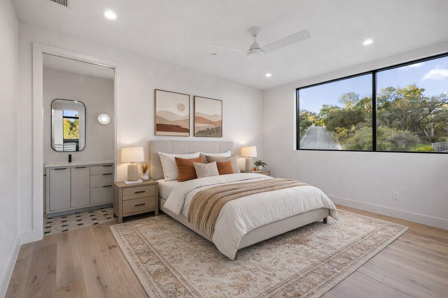 607 Westbrook Drive Austin, TX 78746 - Photo 32 of 32 a bedroom with a large bed and a painting on the wall