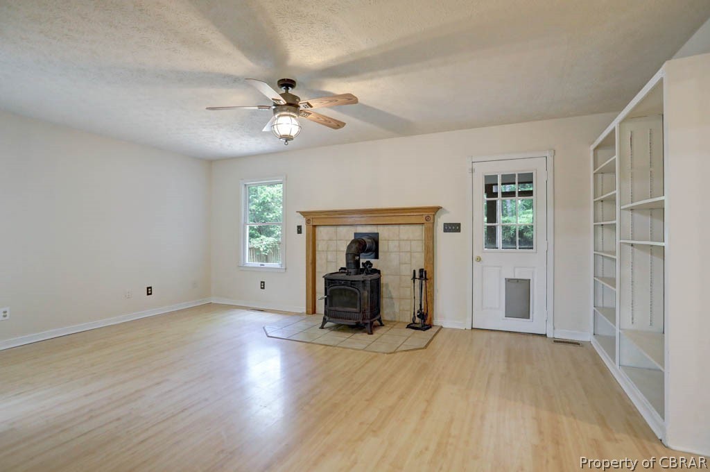 7025 Mumford Cove Road Hayes, VA 23072 - Photo 10 of 43 Family room with door leading to screened in porch.