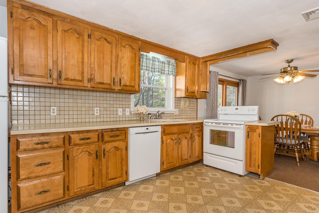 34 Wentworth Road Canton, MA 02021 - Photo 6 of 20 a kitchen with stainless steel appliances granite countertop a stove a sink and a refrigerator