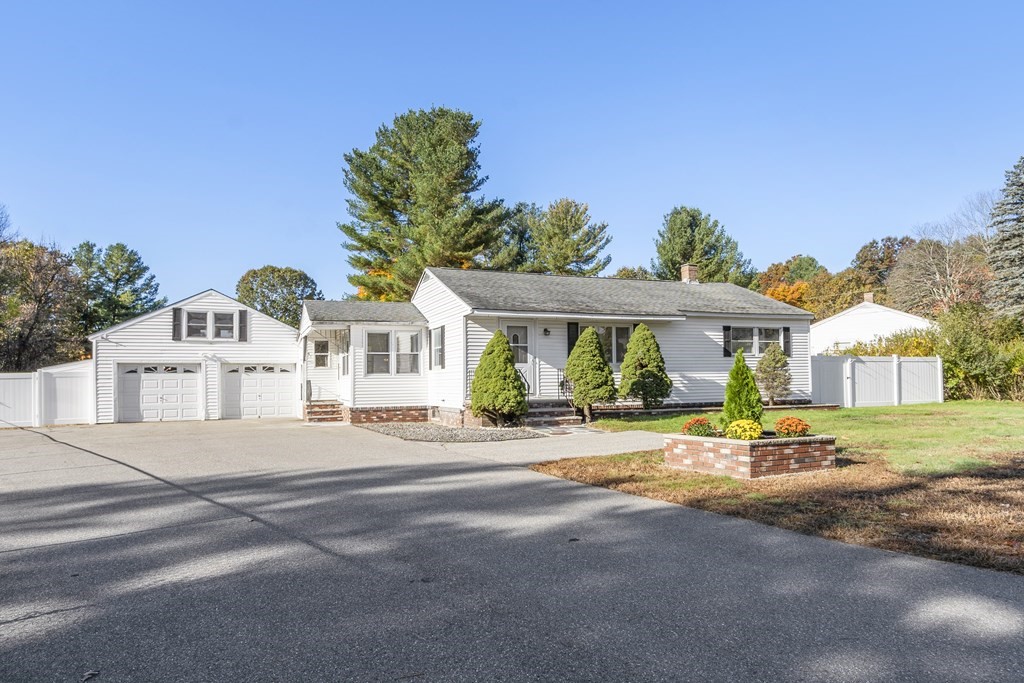 41 Dracut Road Hudson, NH 03051 - Photo 1 of 37 front view of a house with a view of big yard