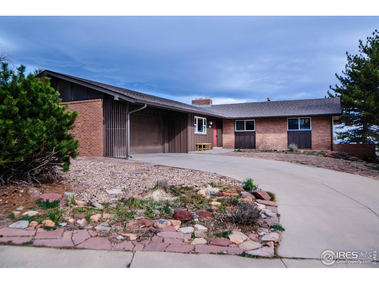 2425 Vassar Drive Boulder, CO 80305 - Photo 1 of 30 a front view of a house with a yard