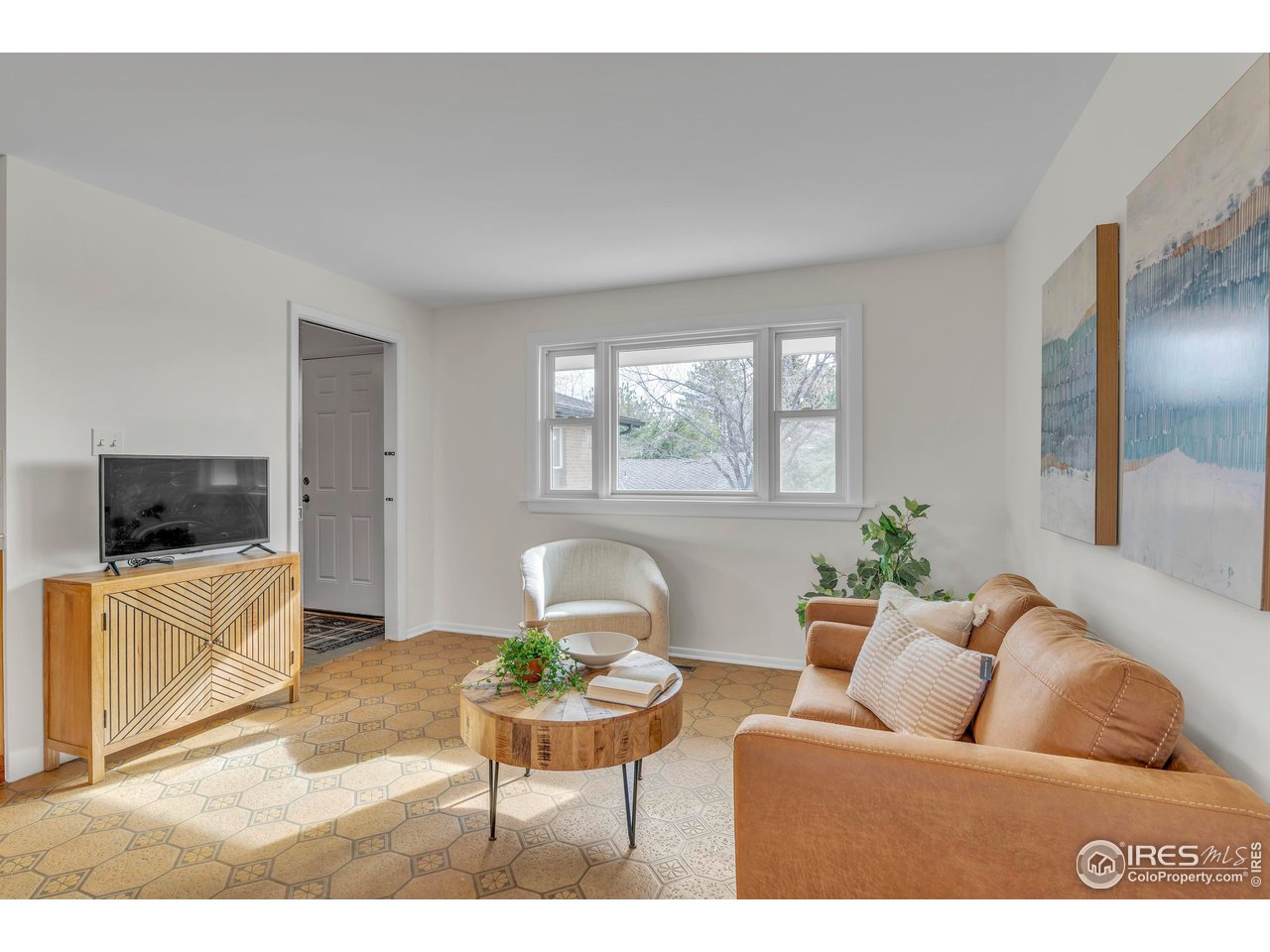 2425 Vassar Drive Boulder, CO 80305 - Photo 13 of 30 a living room with furniture and a flat screen tv