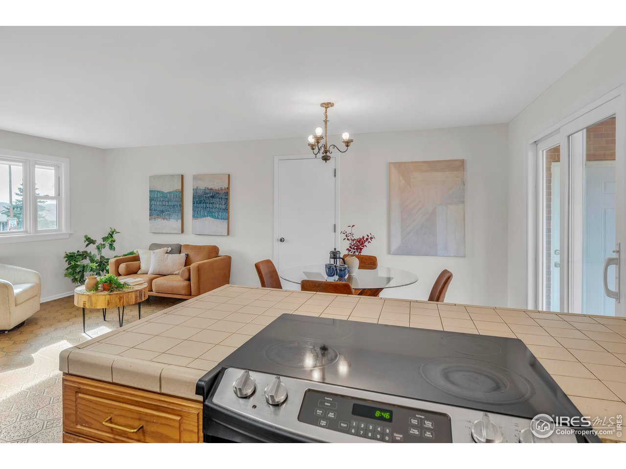 2425 Vassar Drive Boulder, CO 80305 - Photo 14 of 30 a living room with furniture and a chandelier