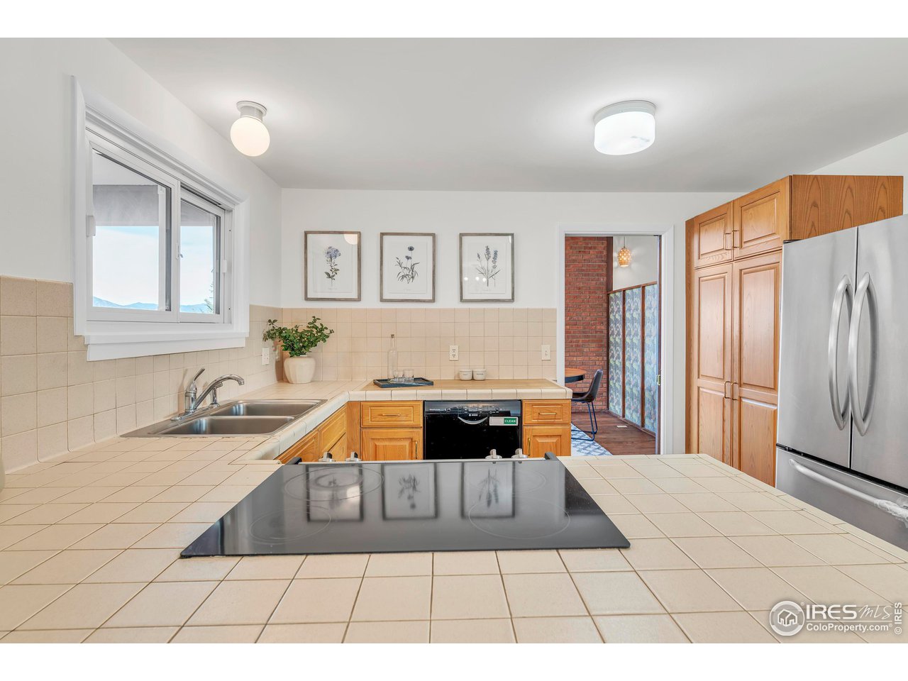 2425 Vassar Drive Boulder, CO 80305 - Photo 15 of 30 a living room with a couch and a stove top oven