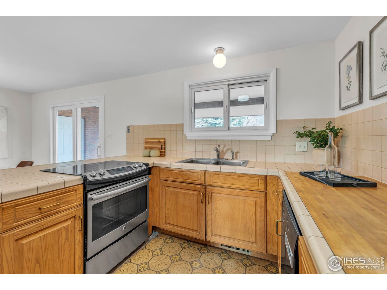 2425 Vassar Drive Boulder, CO 80305 - Photo 16 of 30 a kitchen with granite countertop a sink stove and cabinets