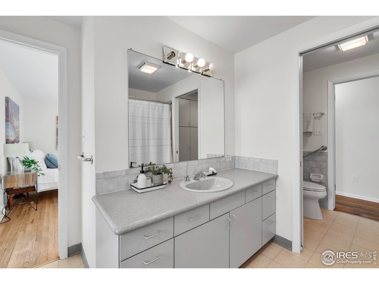 2425 Vassar Drive Boulder, CO 80305 - Photo 18 of 30 a bathroom with a sink double vanity granite and a shower