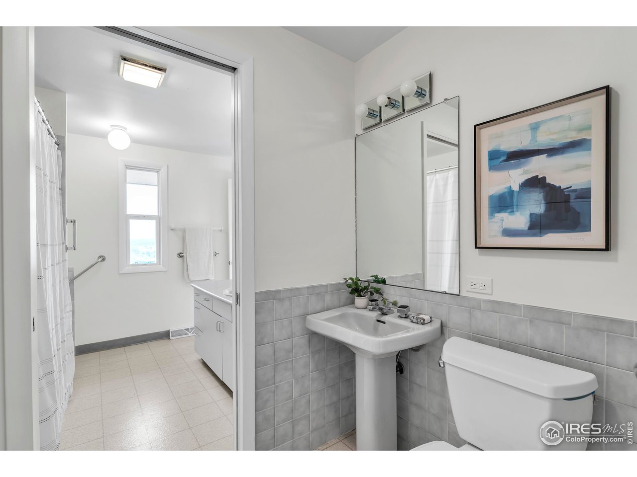 2425 Vassar Drive Boulder, CO 80305 - Photo 20 of 30 a bathroom with a sink and a mirror