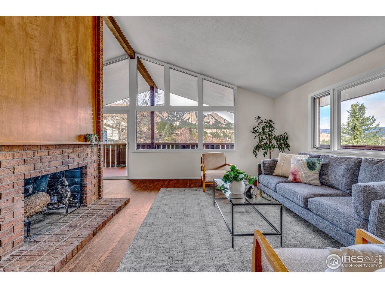 2425 Vassar Drive Boulder, CO 80305 - Photo 2 of 30 a living room with furniture and a fireplace