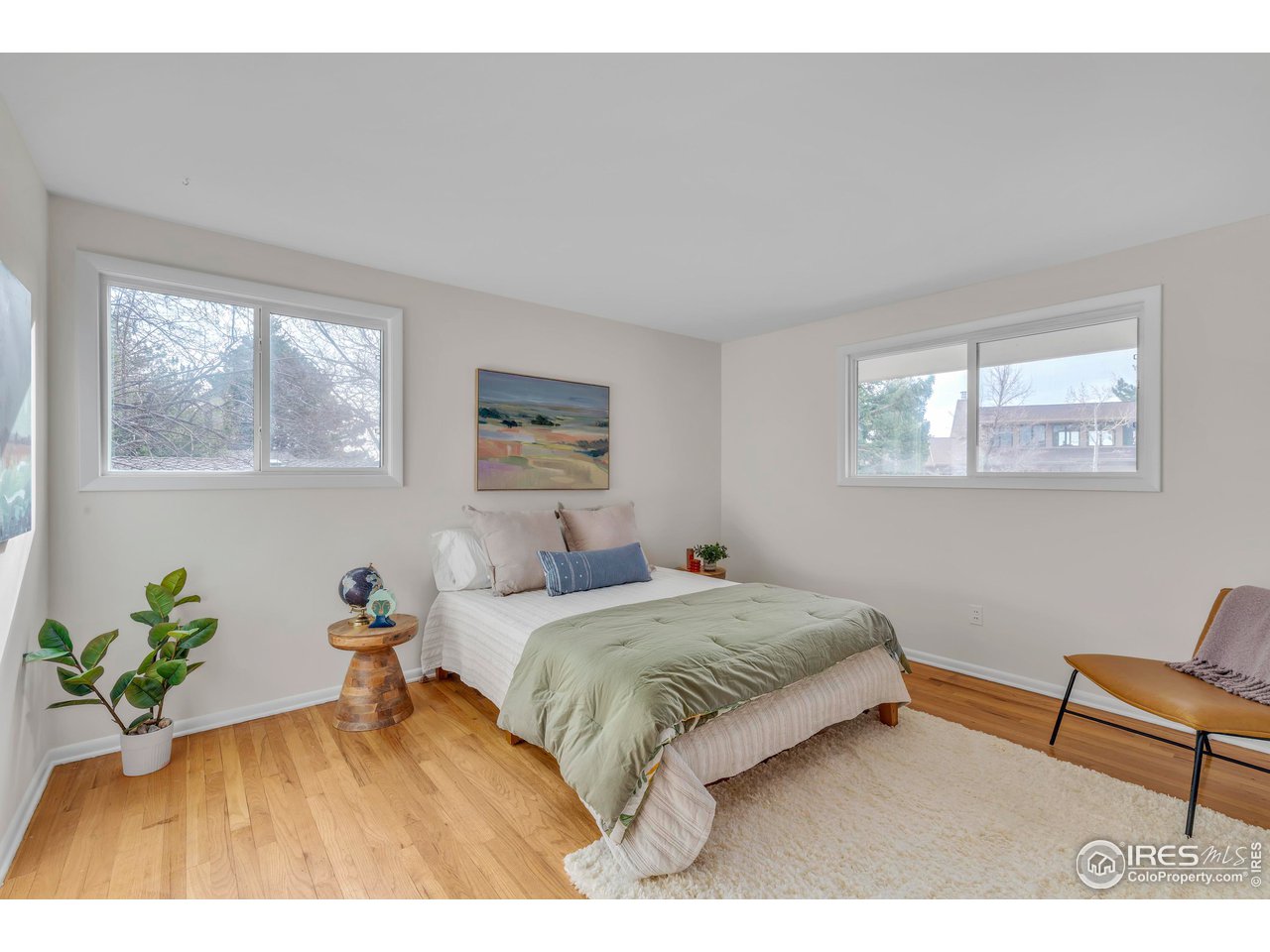 2425 Vassar Drive Boulder, CO 80305 - Photo 21 of 30 a living room with a bed furniture and a window