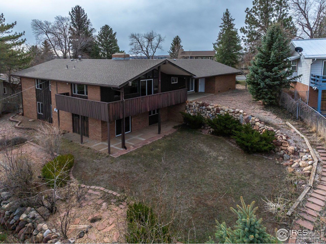 2425 Vassar Drive Boulder, CO 80305 - Photo 25 of 30 a view of a house with a yard and hanging chair