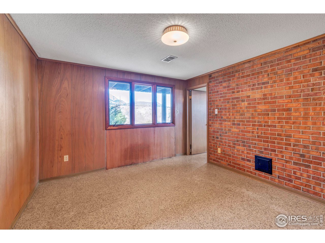 2425 Vassar Drive Boulder, CO 80305 - Photo 27 of 30 a view of an empty room with a window