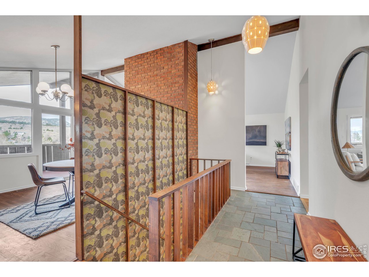 2425 Vassar Drive Boulder, CO 80305 - Photo 4 of 30 a view of a hallway with furniture and floor to ceiling window