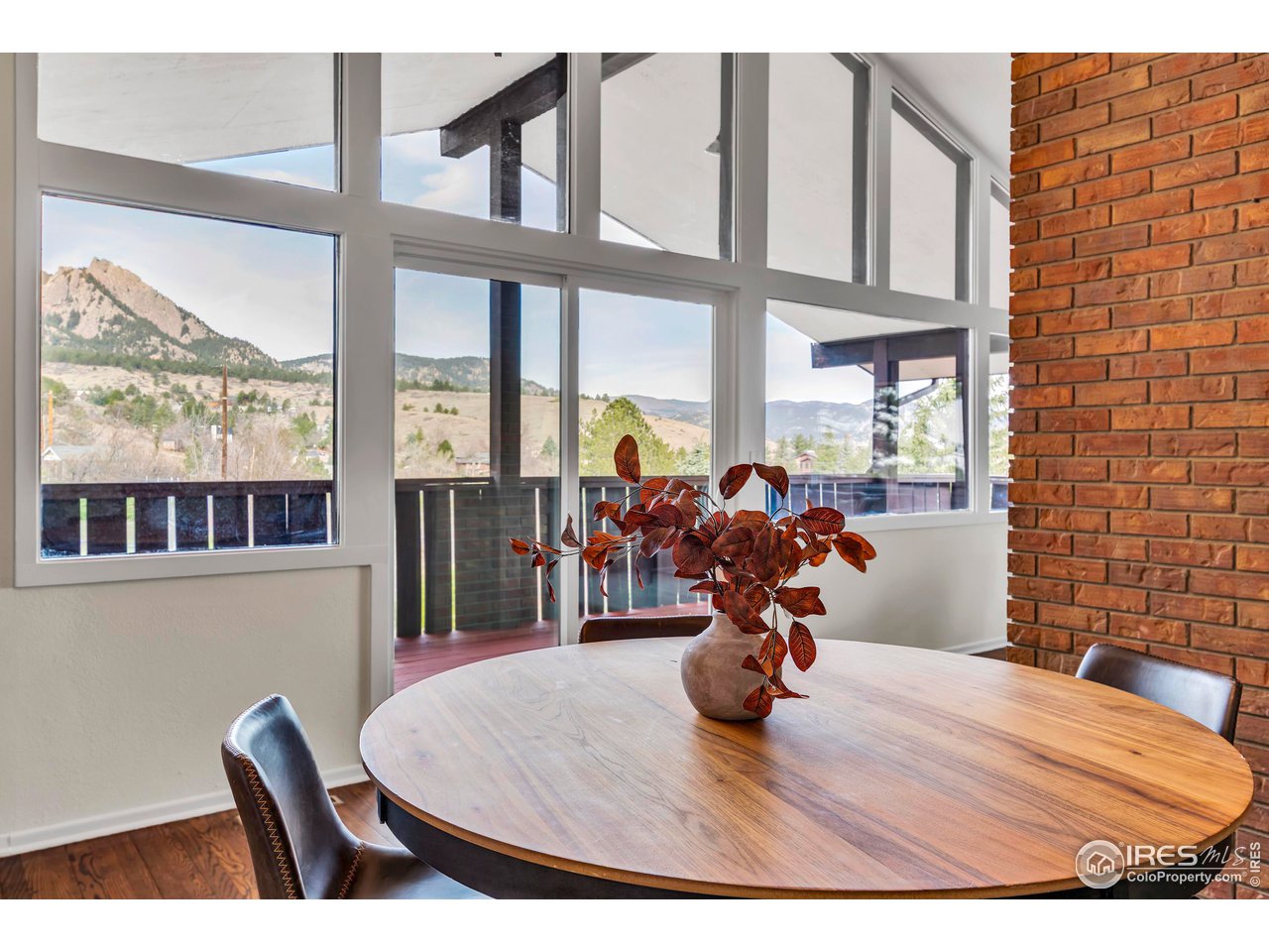 2425 Vassar Drive Boulder, CO 80305 - Photo 8 of 30 a view of a dining room with furniture window and wooden floor