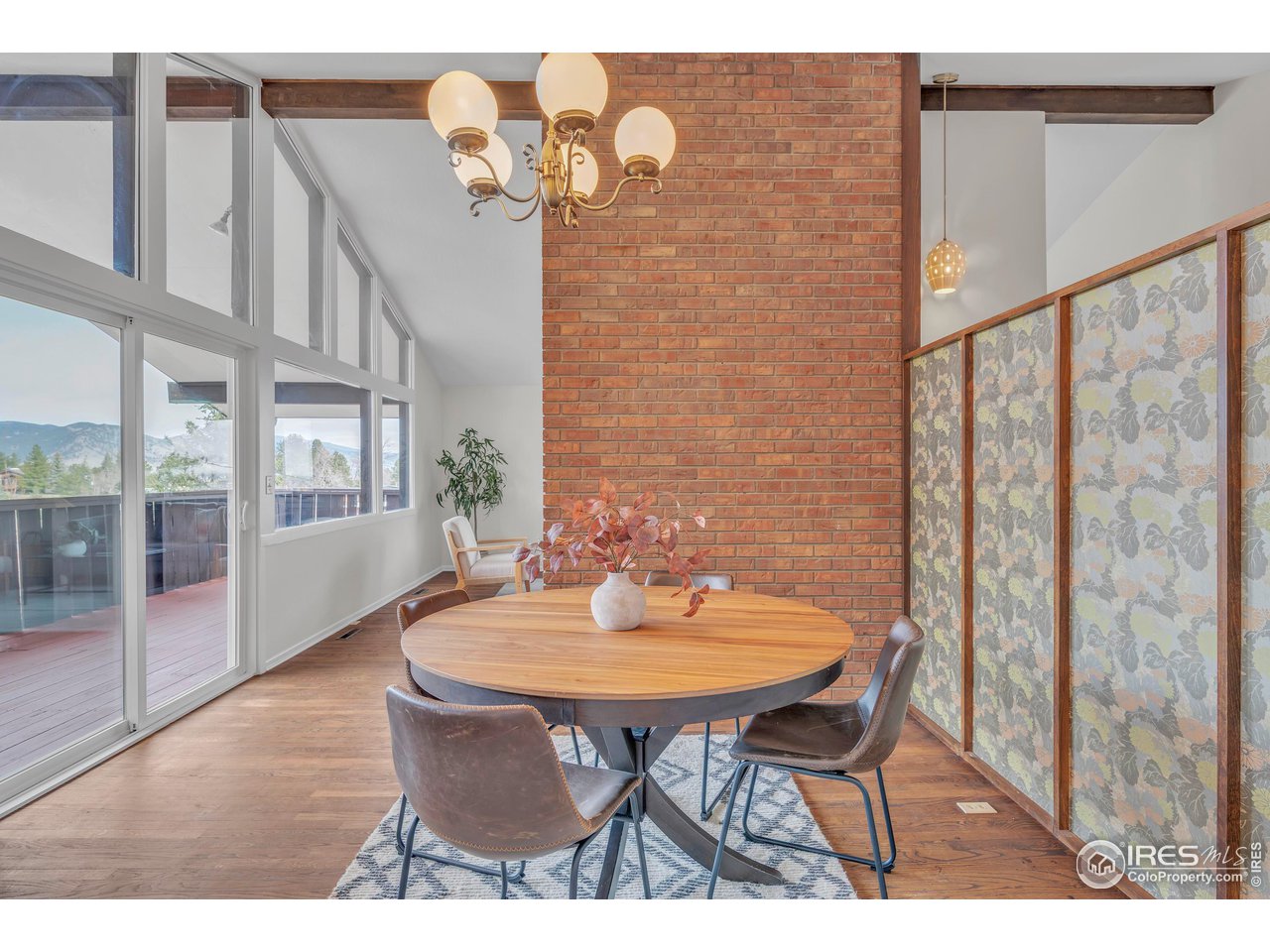 2425 Vassar Drive Boulder, CO 80305 - Photo 9 of 30 a balcony with table and chairs