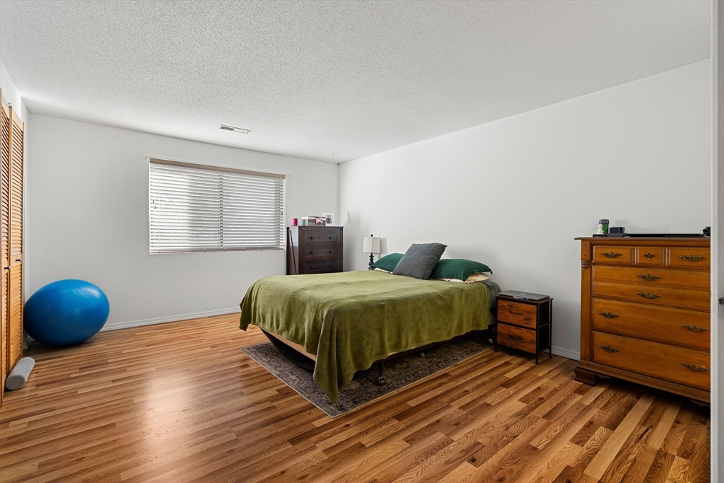 181 Littleton Road, Unit 134 Chelmsford, MA 01824 - Photo 12 of 20 a bedroom with a bed and window