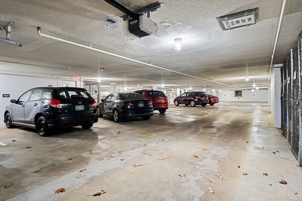 181 Littleton Road, Unit 134 Chelmsford, MA 01824 - Photo 16 of 20 a view of parking garage with cars