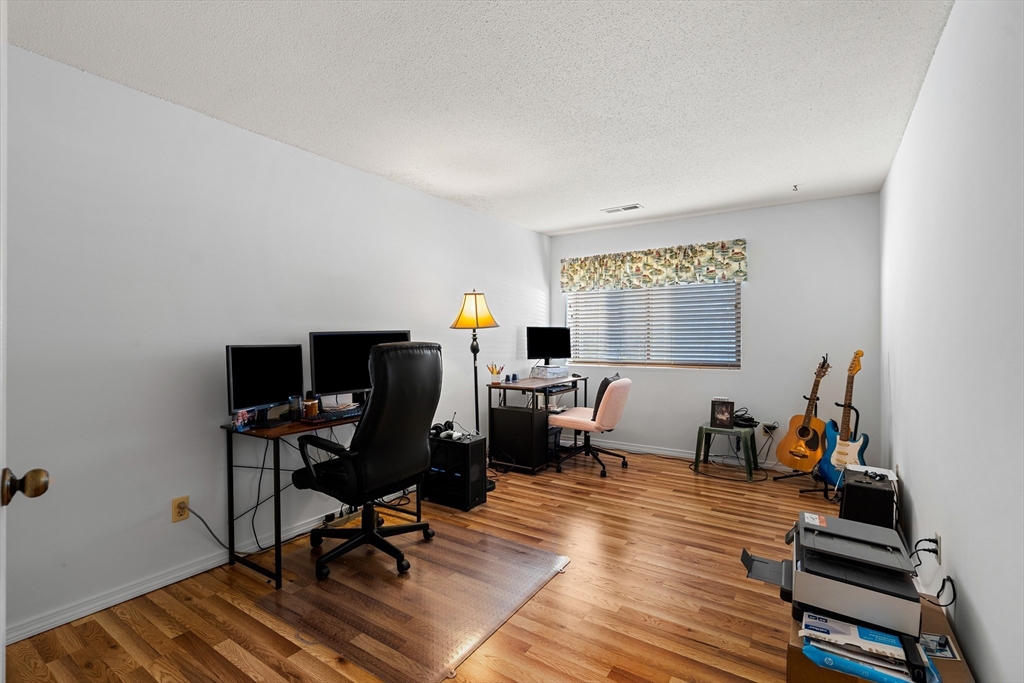 181 Littleton Road, Unit 134 Chelmsford, MA 01824 - Photo 10 of 20 a view of a workspace with furniture and a window