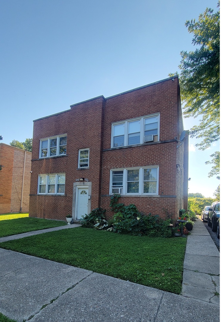 a brick house with a large windows
