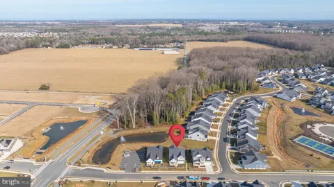 an aerial view of residential houses and outdoor space