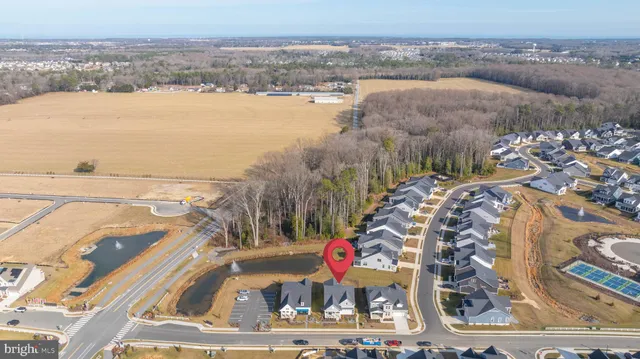 an aerial view of residential houses and outdoor space