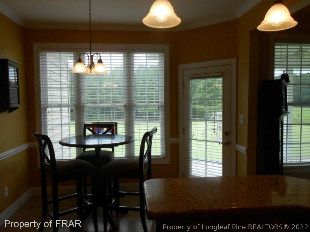 6257 Howell Road Lumberton, NC 28358 - Photo 18 of 34 a view of a dining room with furniture window and outside view
