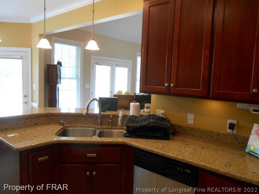 6257 Howell Road Lumberton, NC 28358 - Photo 20 of 34 a kitchen with a sink and cabinets