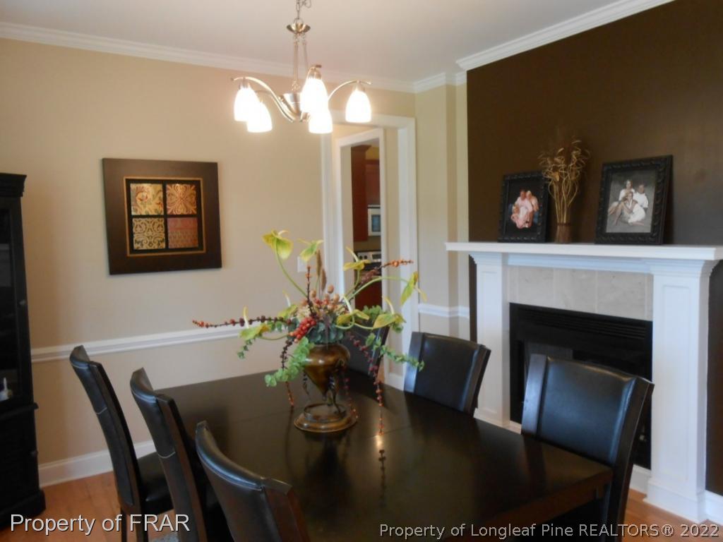 6257 Howell Road Lumberton, NC 28358 - Photo 21 of 34 a view of a dining room with furniture and chandelier