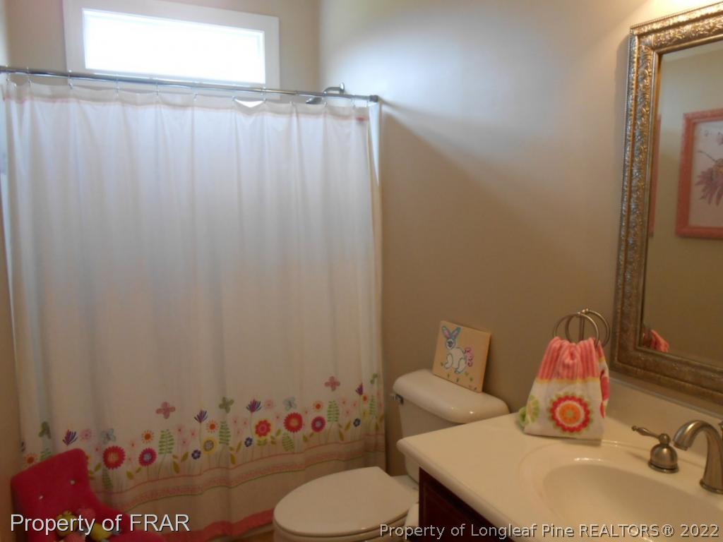 6257 Howell Road Lumberton, NC 28358 - Photo 23 of 34 a bathroom with a sink toilet and shower