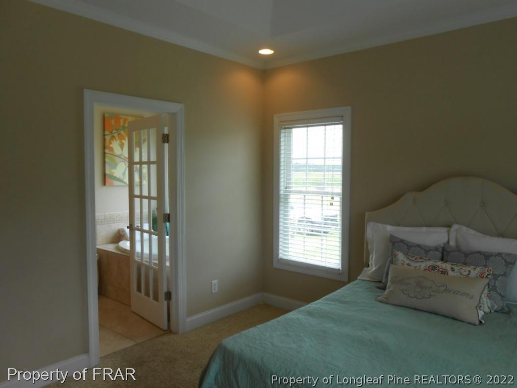 6257 Howell Road Lumberton, NC 28358 - Photo 28 of 34 a bedroom with a bed and window