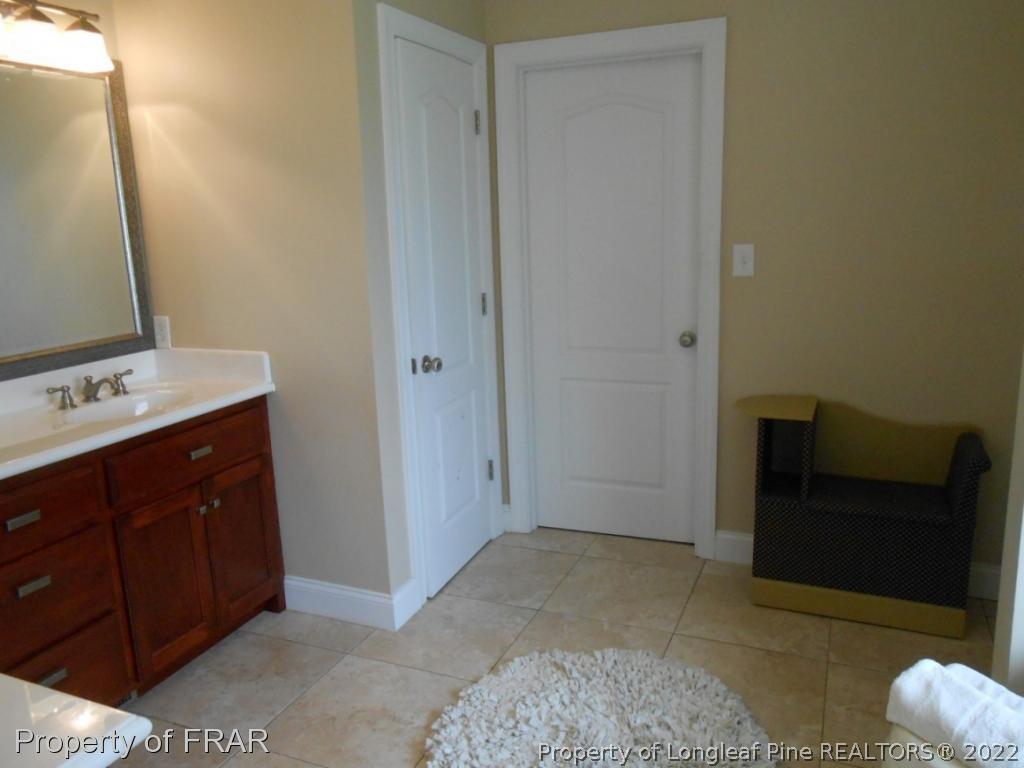 6257 Howell Road Lumberton, NC 28358 - Photo 30 of 34 a view of bathroom with a sink and a mirror
