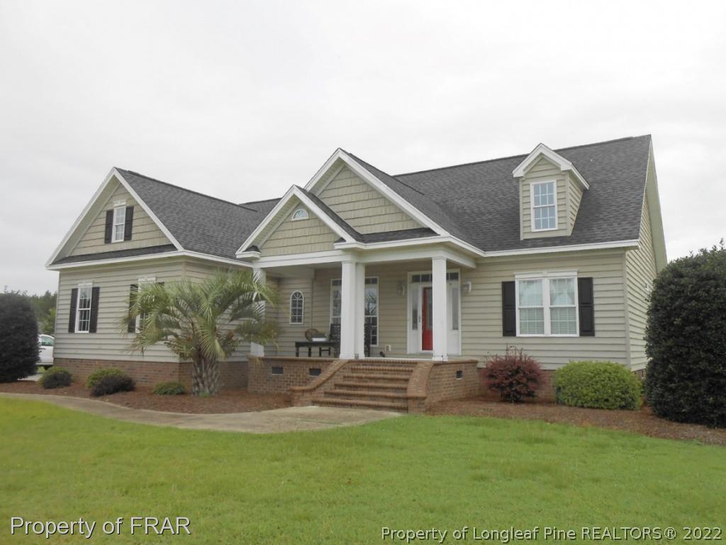 6257 Howell Road Lumberton, NC 28358 - Photo 4 of 34 a view of a house with a yard