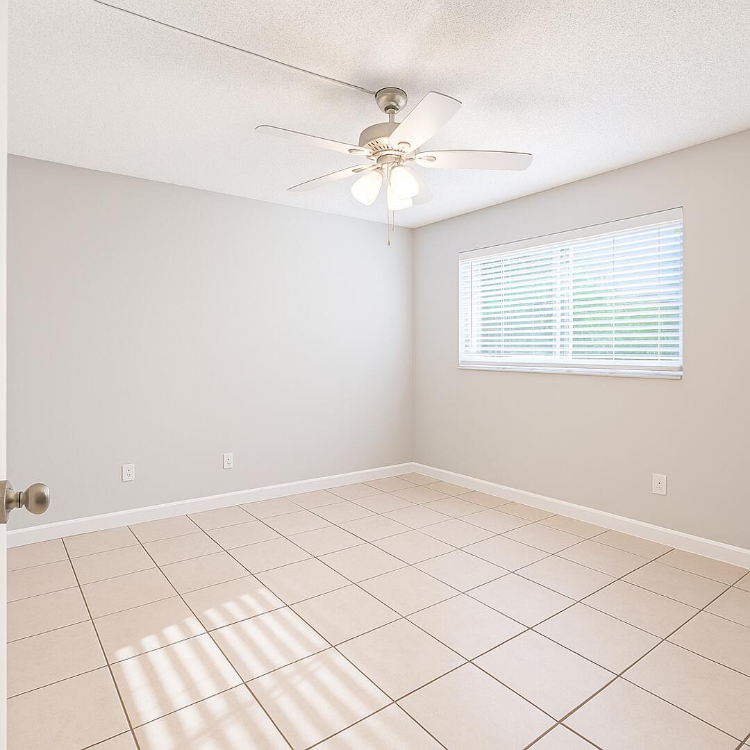 665 Glouchester Street, Unit 6 Boca Raton, FL 33487 - Photo 4 of 16 a view of an empty room with a window