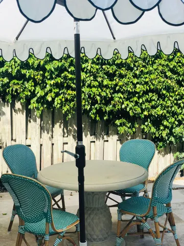 a view of a chairs in wooden deck