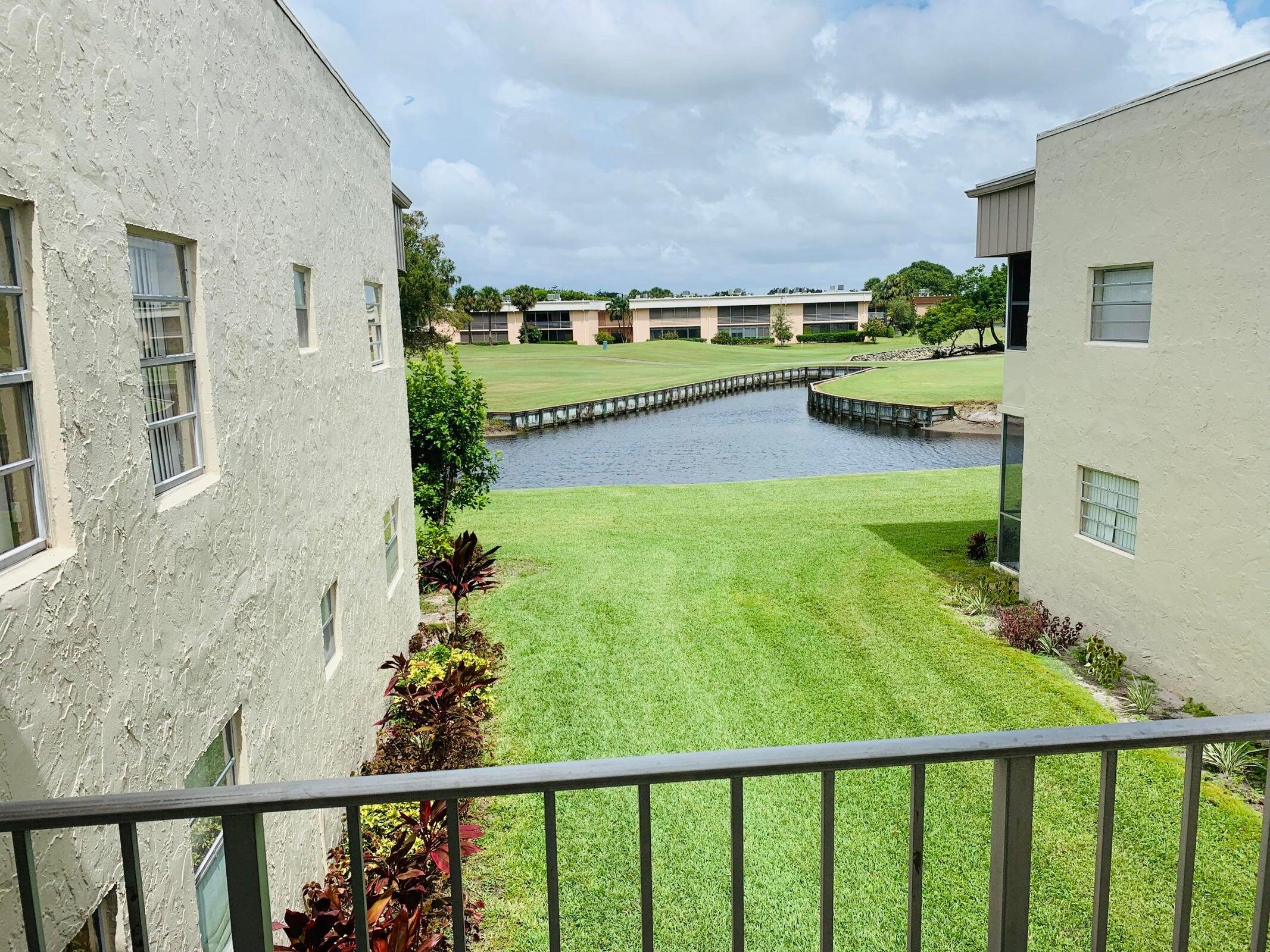 a view of swimming pool from a balcony