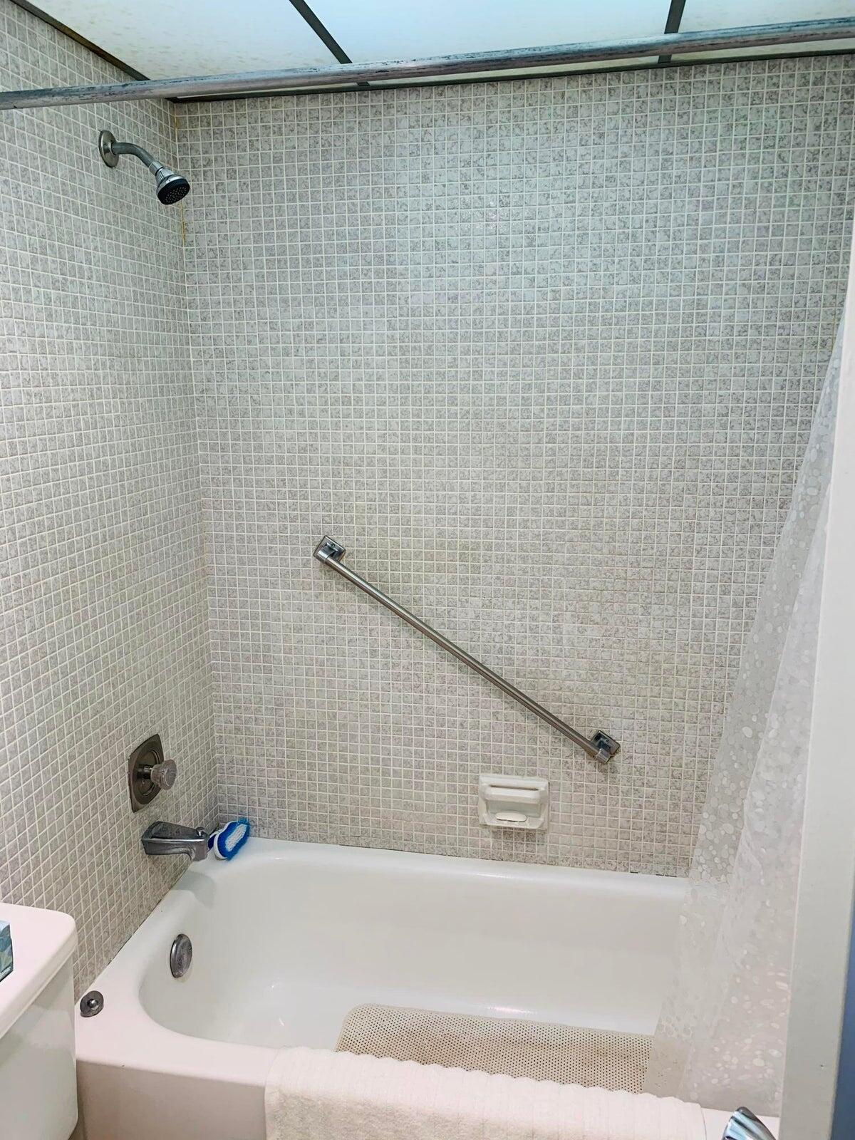 514 Flanders K Delray Beach, FL 33484 - Photo 4 of 10 a bathroom with a bathtub and a shower