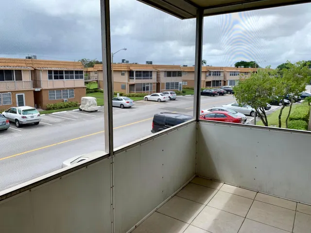 a view of a yard and a palm tree