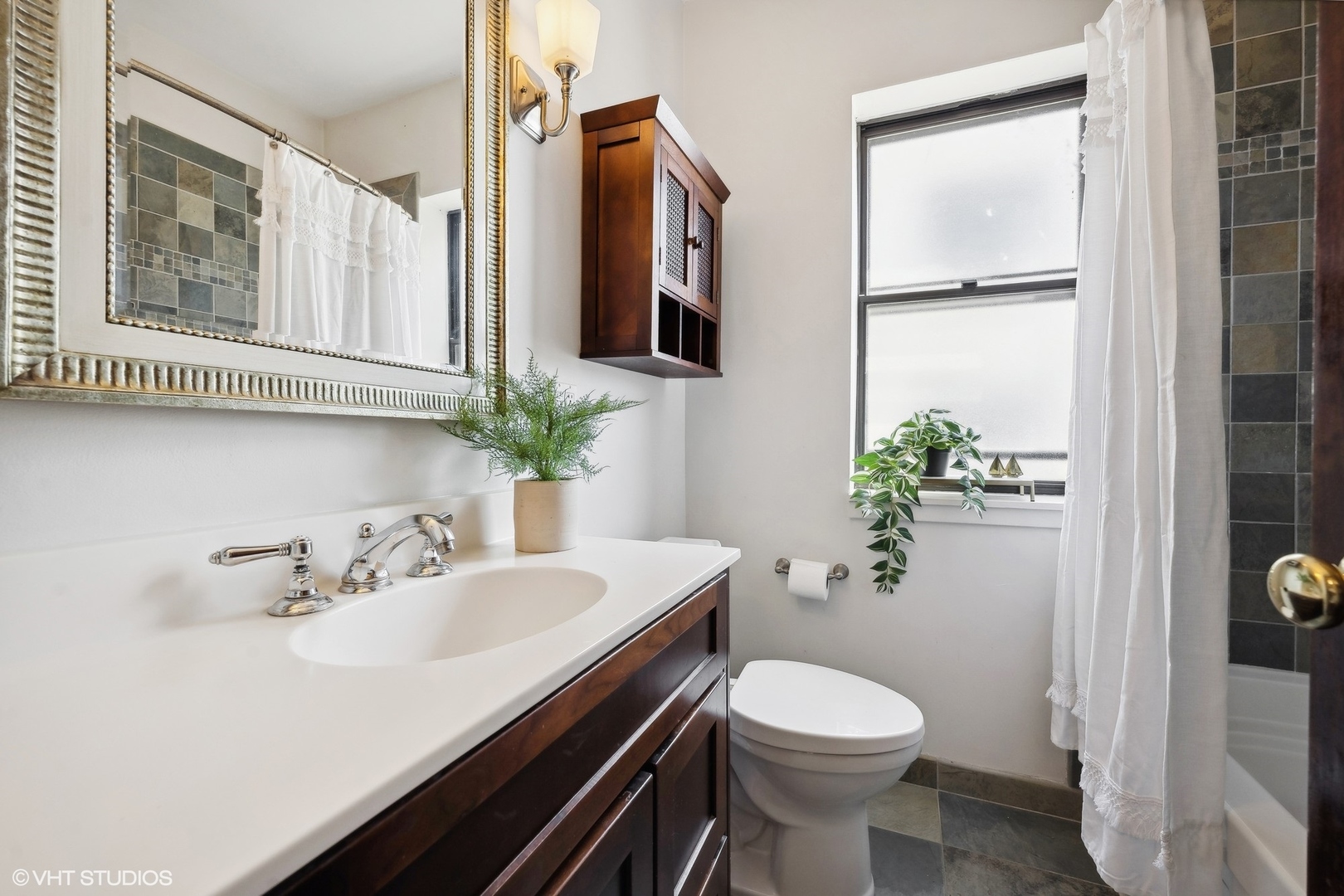 3749 North Pine Grove Avenue, Unit 3 Chicago, IL 60613 - Photo 16 of 18 a bathroom with a sink toilet and shower
