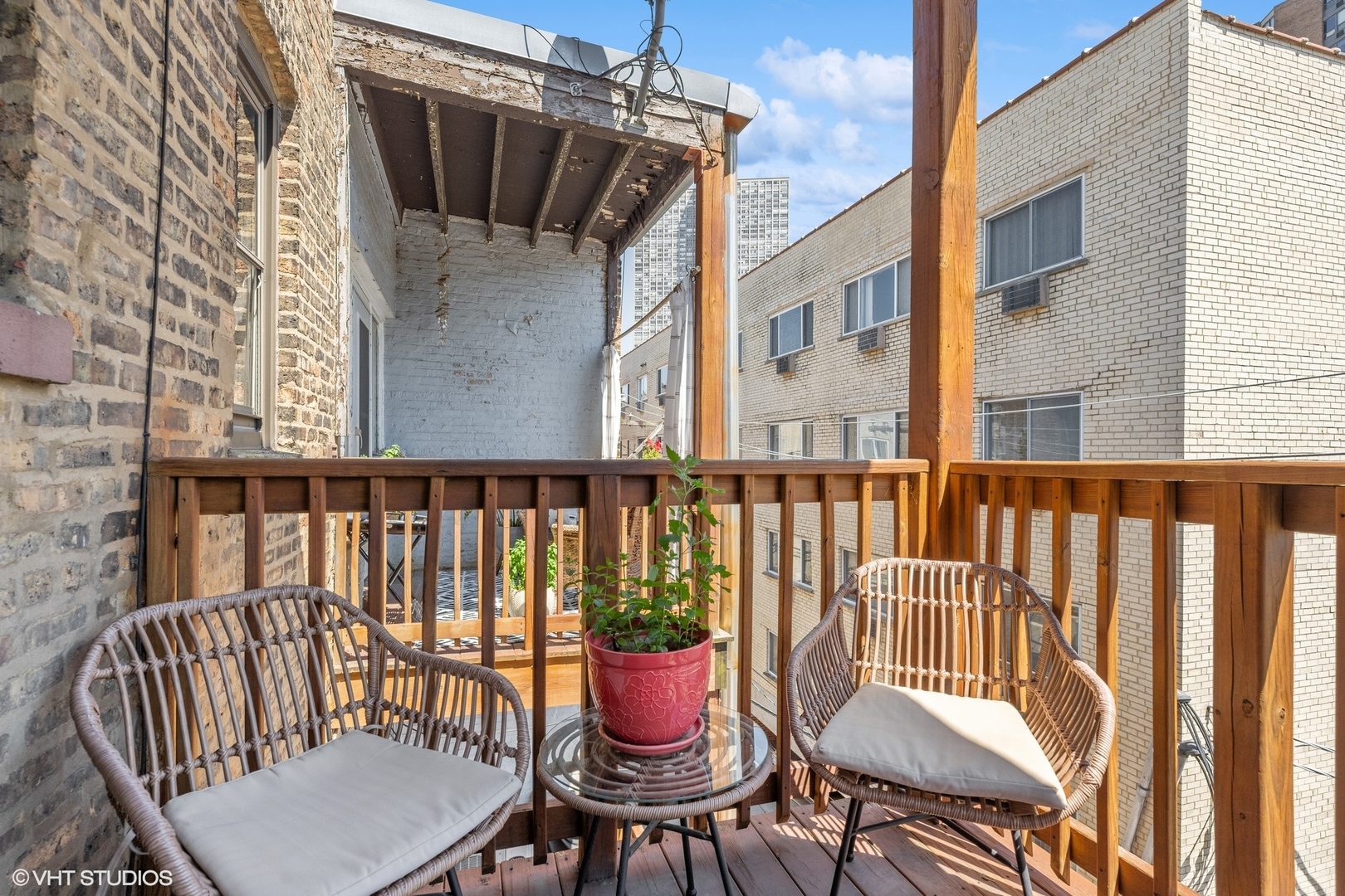 3749 North Pine Grove Avenue, Unit 3 Chicago, IL 60613 - Photo 17 of 18 a view of a chair and table in the balcony