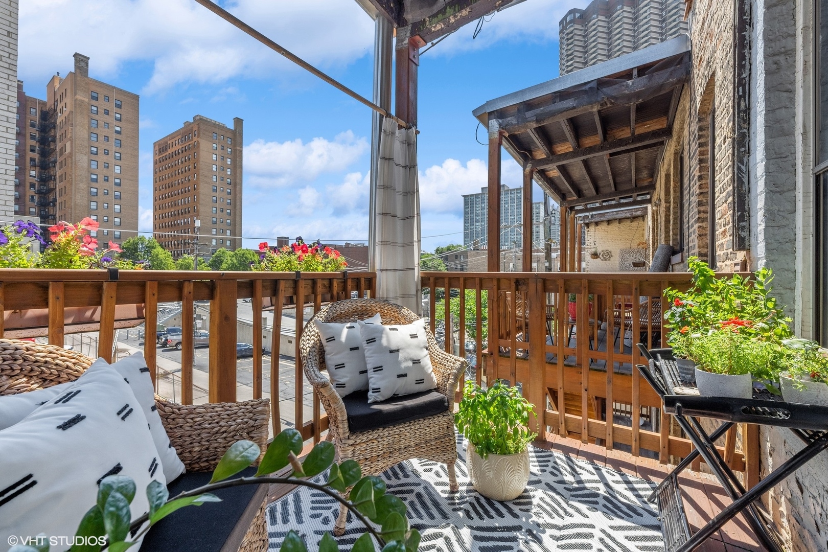3749 North Pine Grove Avenue, Unit 3 Chicago, IL 60613 - Photo 18 of 18 a front view of a house with outdoor seating and plants