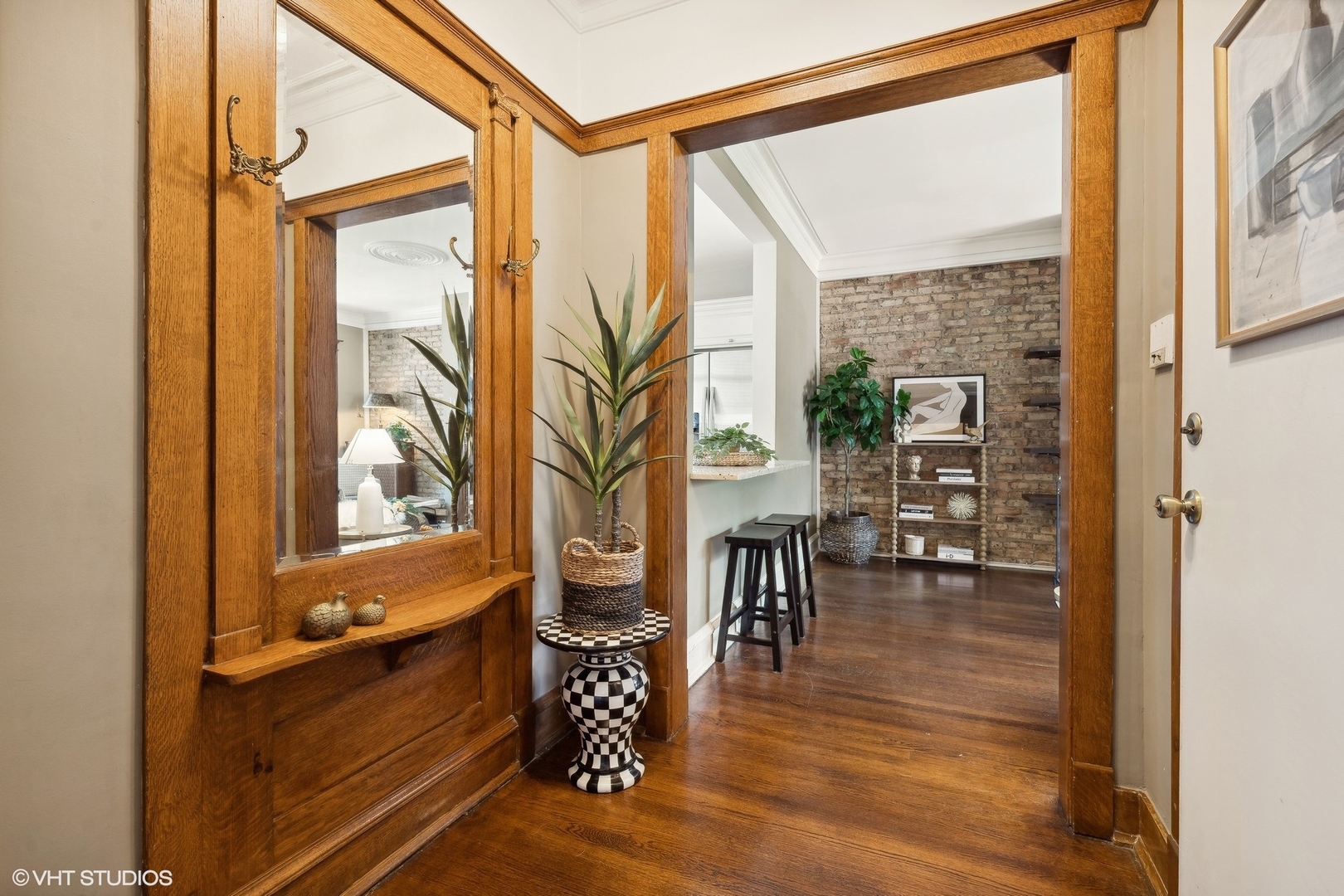 3749 North Pine Grove Avenue, Unit 3 Chicago, IL 60613 - Photo 2 of 18 a view of living room with furniture and floor to ceiling windows
