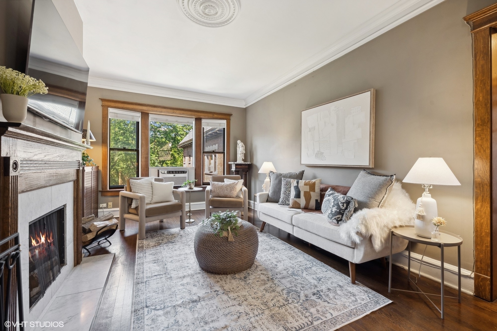 3749 North Pine Grove Avenue, Unit 3 Chicago, IL 60613 - Photo 4 of 18 a living room with furniture and a fireplace