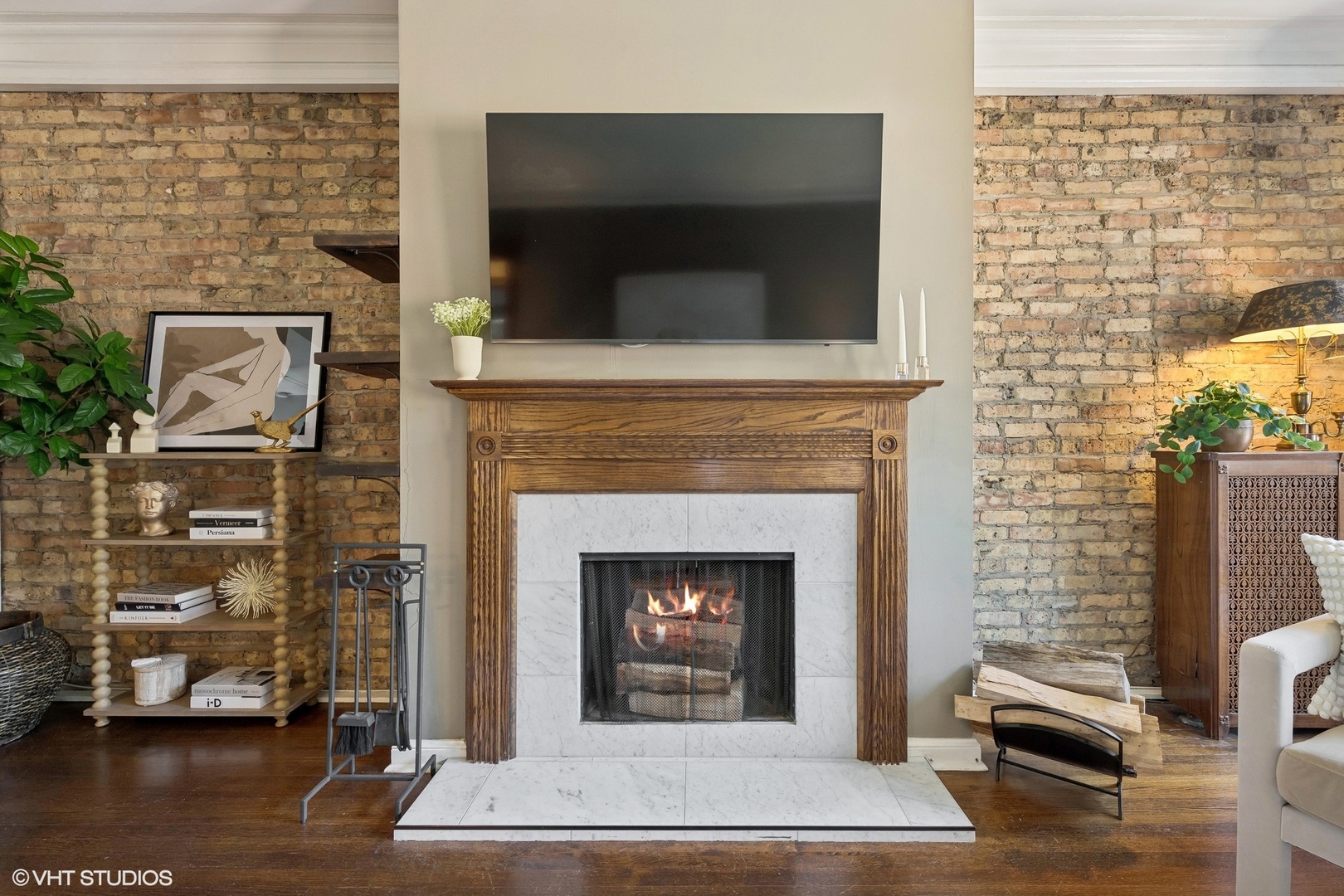 3749 North Pine Grove Avenue, Unit 3 Chicago, IL 60613 - Photo 6 of 18 a living room with a fireplace a flat screen tv and a fireplace