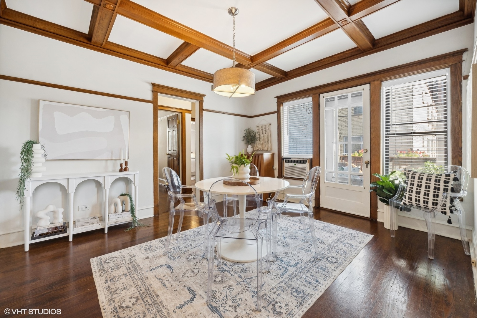 3749 North Pine Grove Avenue, Unit 3 Chicago, IL 60613 - Photo 8 of 18 a living room with couches a dining table with wooden floor and a dining table